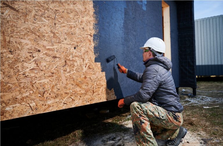 male painter using paint roller doing exterior pa 2023 11 27 04 59 49 utc